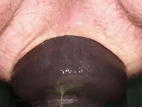 Huge 11cm wide butt plug sliding in my ass on toilet seat up close.